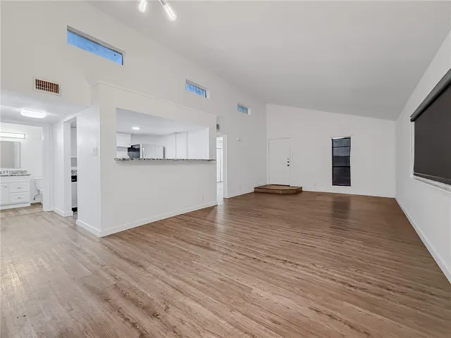 a view of a livingroom with wooden floor