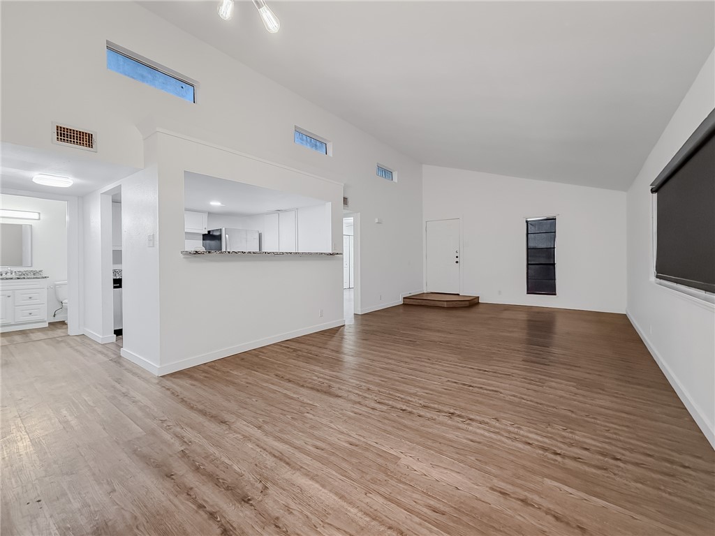 302 Easy Street, Unit B Corpus Christi, TX 78418 - Photo 7 of 27 a view of a livingroom with wooden floor