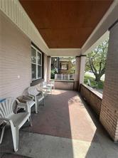 5807 Bartlett Street, Unit 3 Pittsburgh, PA 15217 - Photo 4 of 6 a living room with couches and a large window with outer view