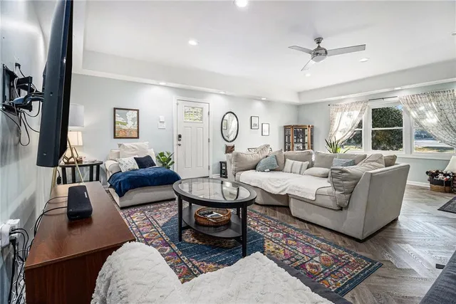 a living room with furniture and a large window