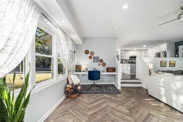a living room with furniture and a large window