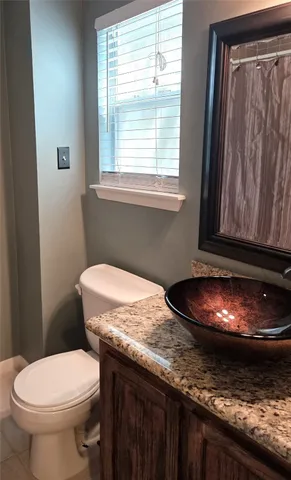 a bathroom with a toilet and a sink