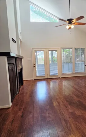 a view of livingroom with hardwood floor and ceiling fan