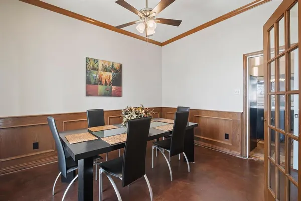 a view of a dining room with furniture and a chandelier