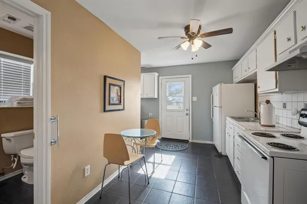 a kitchen with stainless steel appliances a refrigerator and a stove