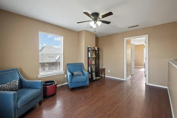 a living room with furniture and a window