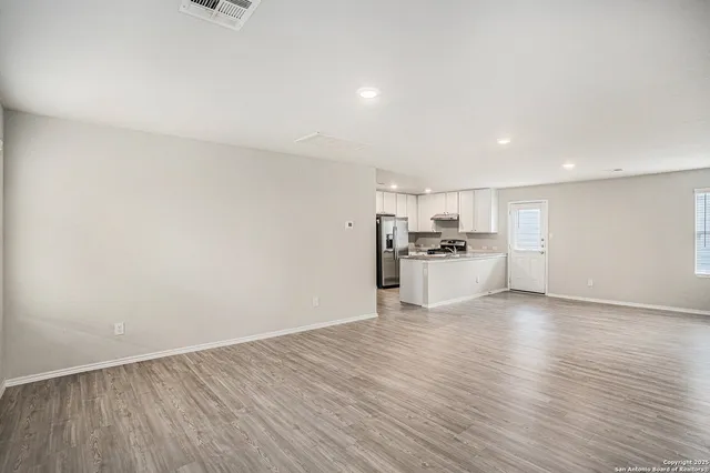 a view of kitchen with wooden floor