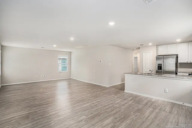 a view of kitchen with wooden floor