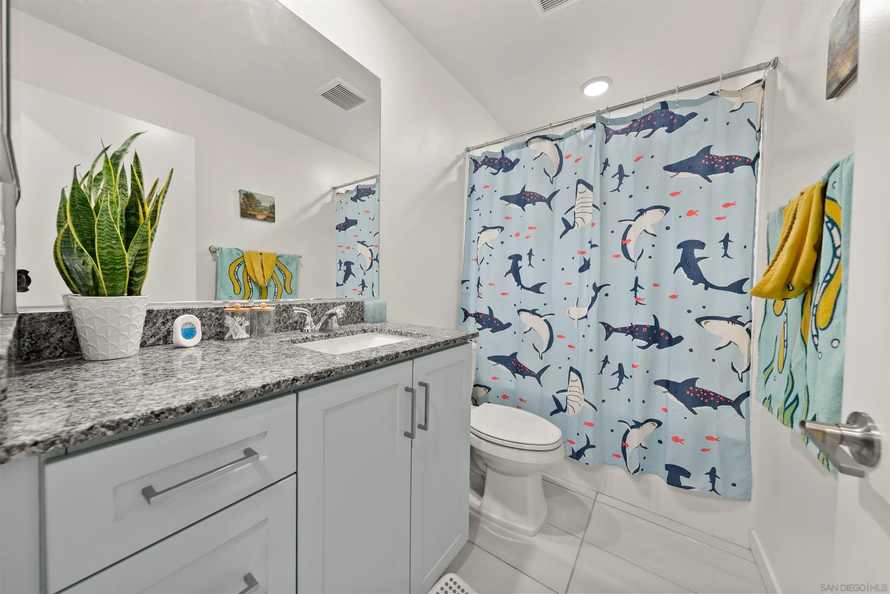 323 Satsuma Trail Fallbrook, CA 92028 - Photo 15 of 28 a bathroom with a granite countertop sink and a mirror
