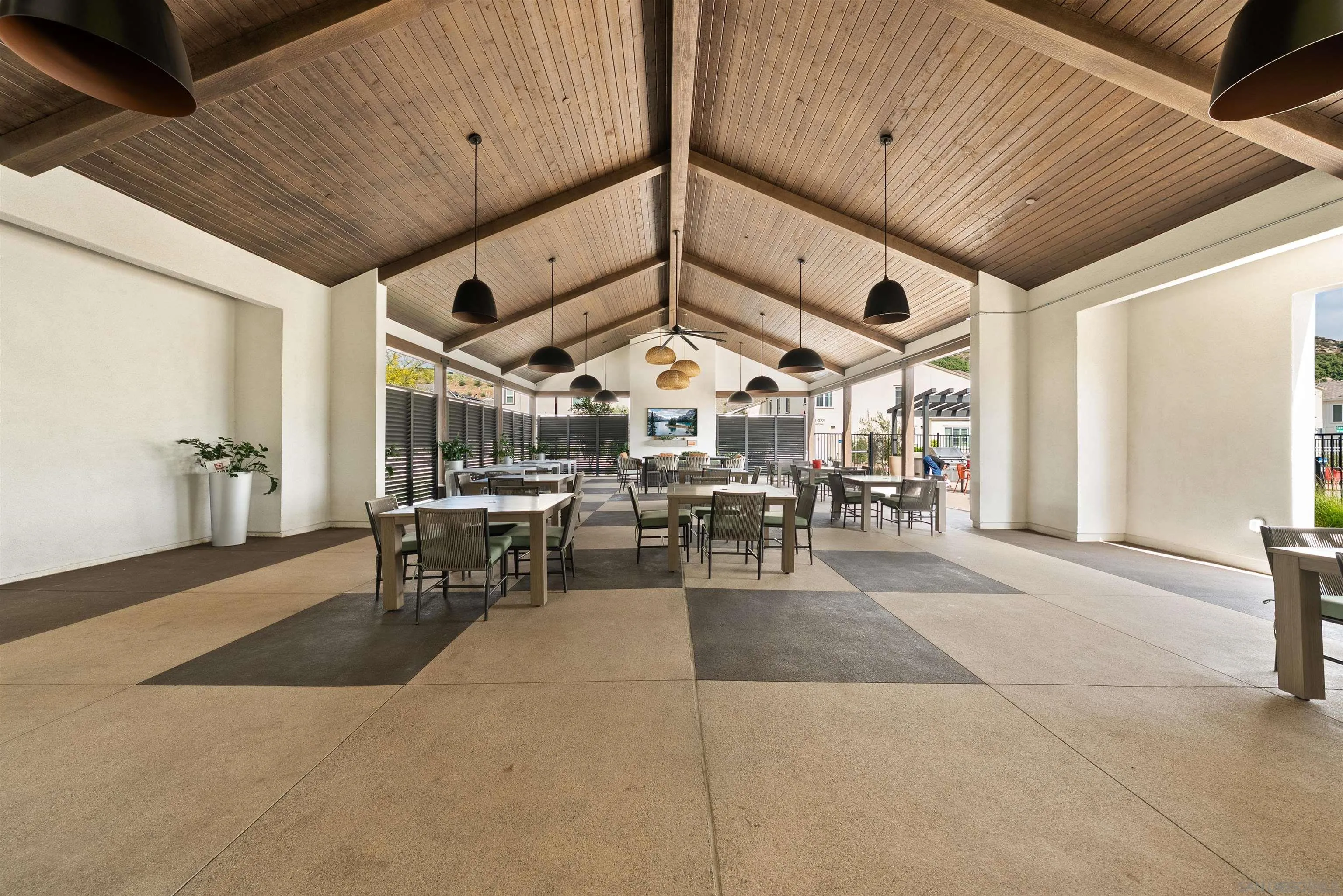 323 Satsuma Trail Fallbrook, CA 92028 - Photo 20 of 28 a view of a patio with table and chairs potted plants with wooden floor