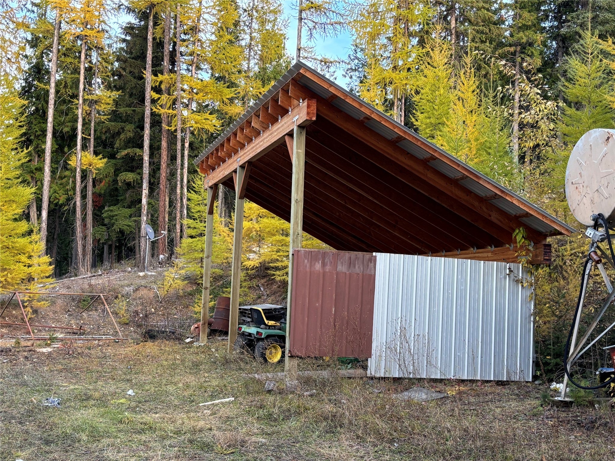 1089 Cedar Hills Road Trego, MT 59934 - Photo 8 of 23 View of pole building featuring a forest view