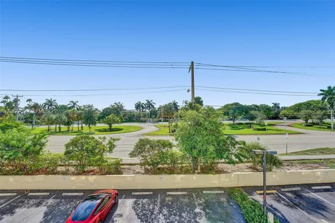 a view of a street with an ocean view