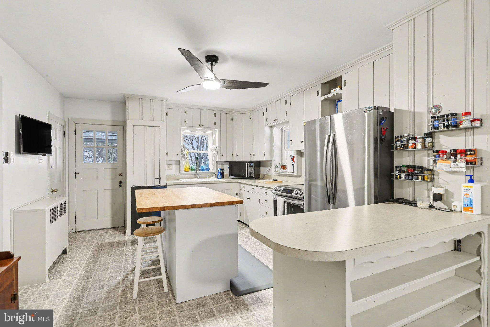 1068 Grandview Road Hanover, PA 17331 - Photo 11 of 31 a kitchen with white cabinets and stainless steel appliances