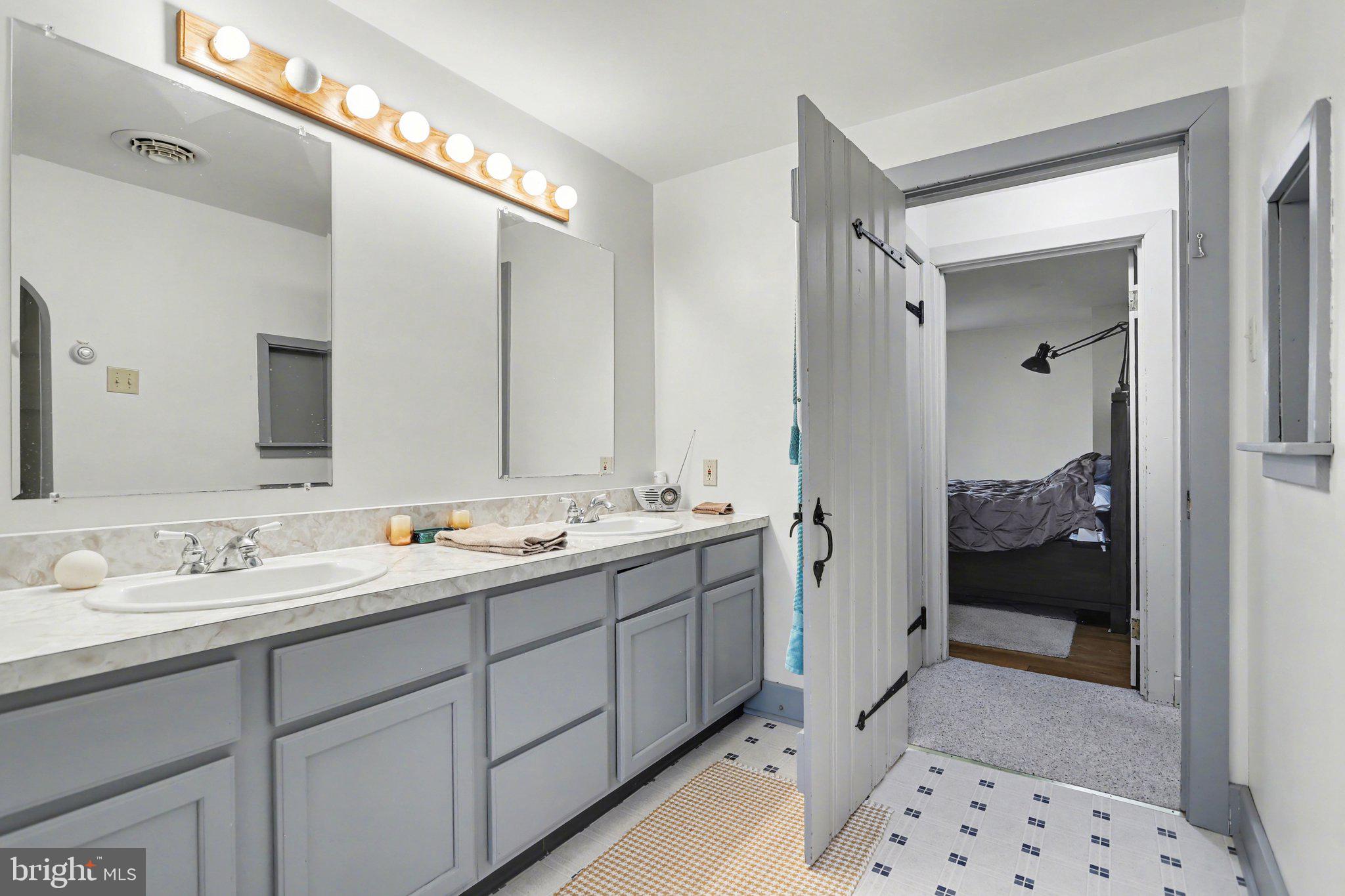 1068 Grandview Road Hanover, PA 17331 - Photo 21 of 31 a en suite bathroom with double sink and a mirror