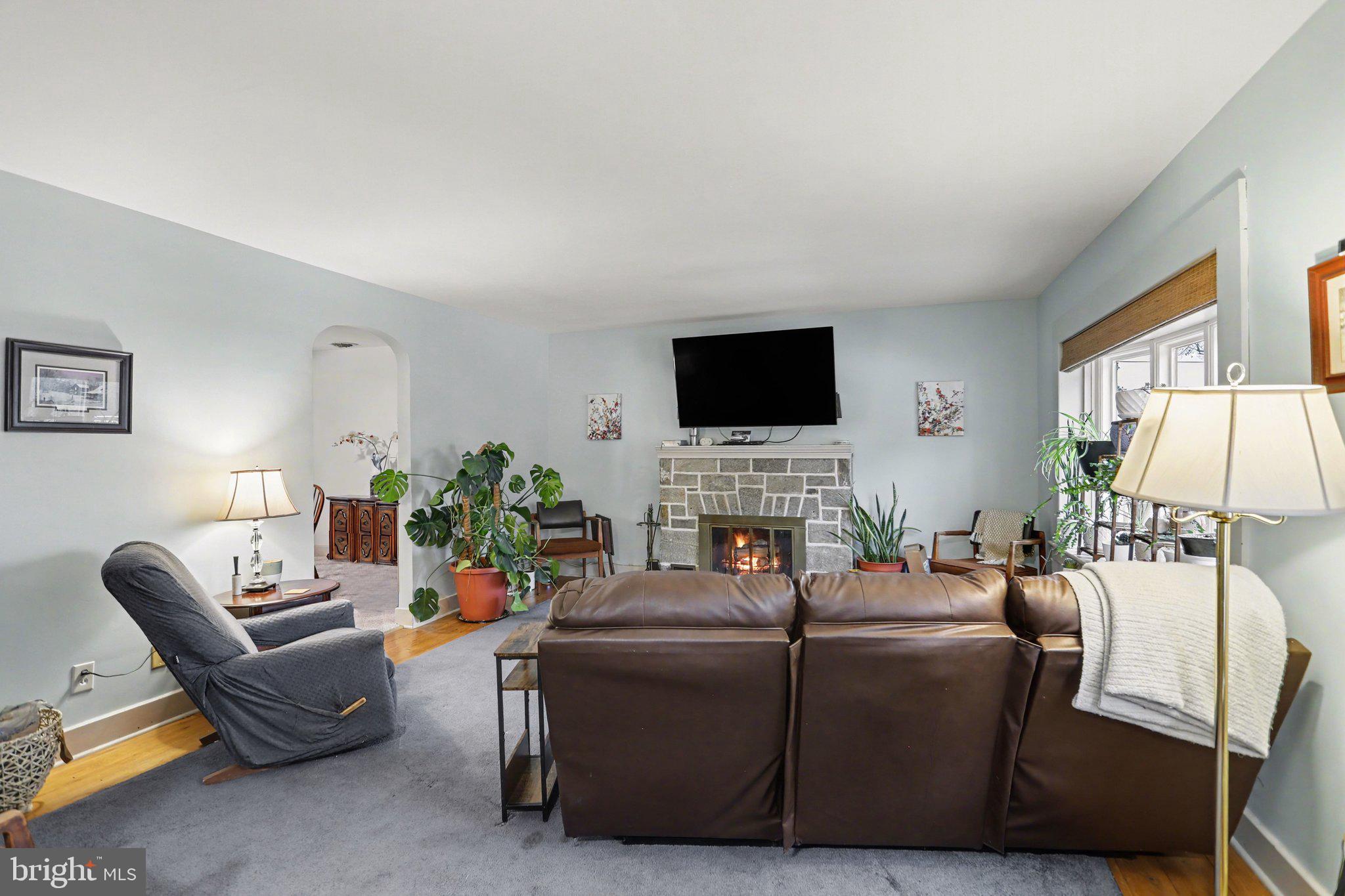 1068 Grandview Road Hanover, PA 17331 - Photo 5 of 31 a living room with furniture a fireplace and a flat screen tv