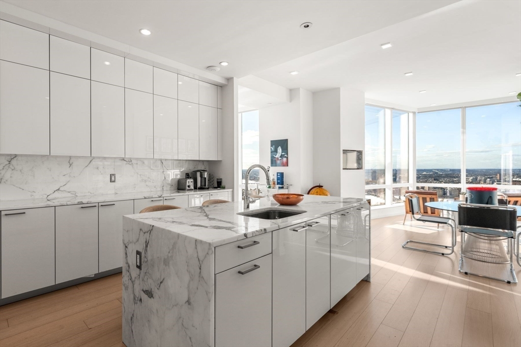 1 Franklin Street, Unit 5002 Boston, MA 02110 - Photo 13 of 40 a view of a kitchen with cabinets