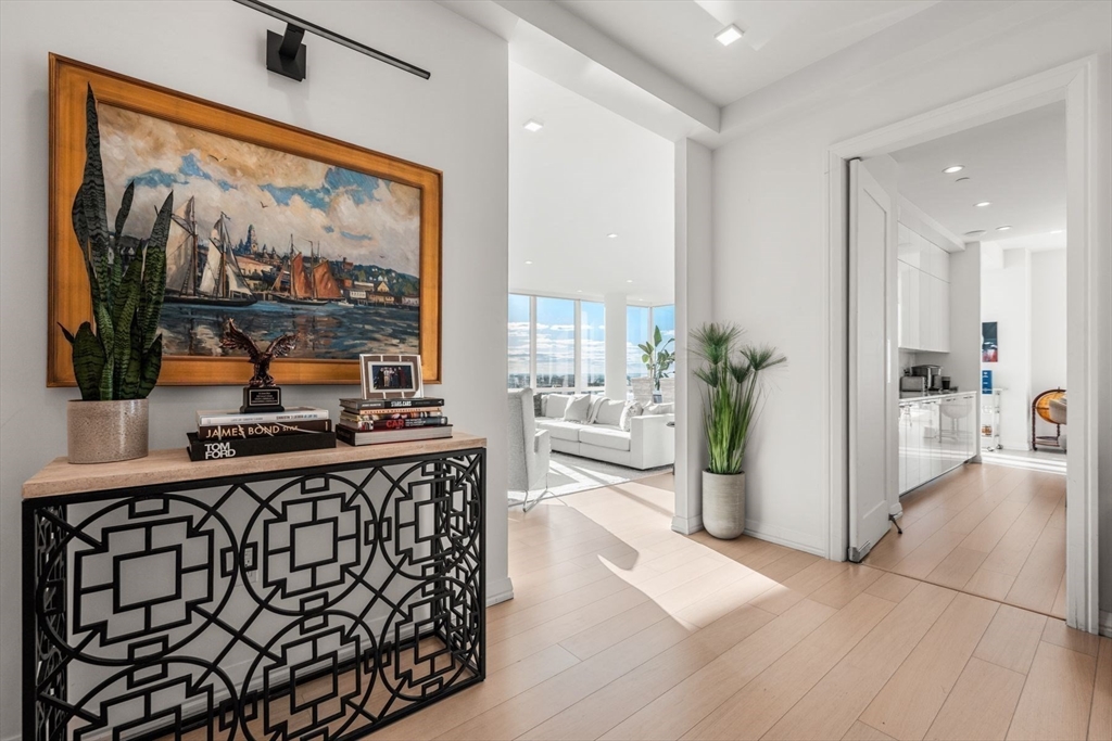 1 Franklin Street, Unit 5002 Boston, MA 02110 - Photo 16 of 40 a kitchen with stainless steel appliances a counter top space and a window