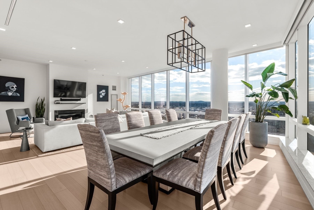 1 Franklin Street, Unit 5002 Boston, MA 02110 - Photo 5 of 40 a view of a dining room with furniture window and wooden floor