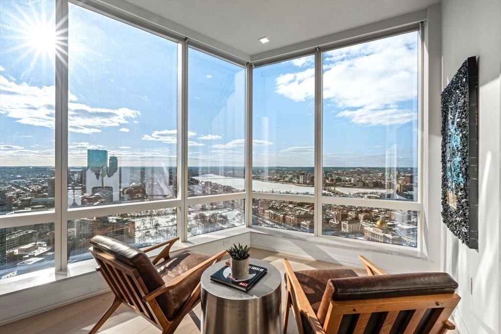 1 Franklin Street, Unit 5002 Boston, MA 02110 - Photo 10 of 40 a view of a living room with furniture and floor to ceiling windows