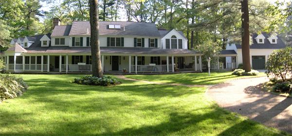 97 Cherry Brook Road Weston, MA 02493 - Photo 1 of 18 a front view of a residential apartment building with a yard