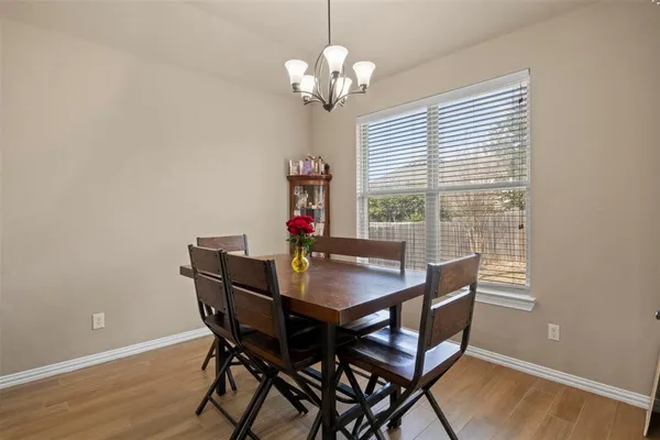 a view of a dining room with furniture and window