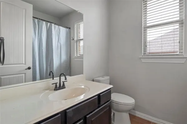 a bathroom with a sink and a toilet
