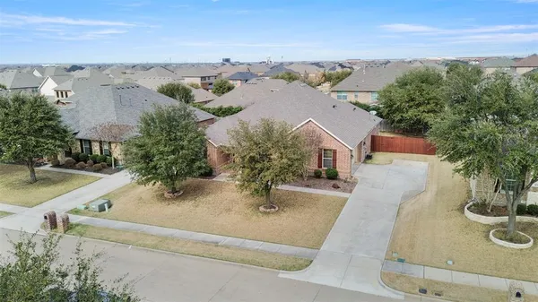 an aerial view of house with yard