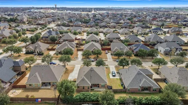an aerial view of residential houses with outdoor space and parking space