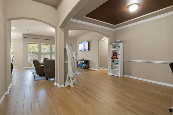 a view of a livingroom with wooden floor