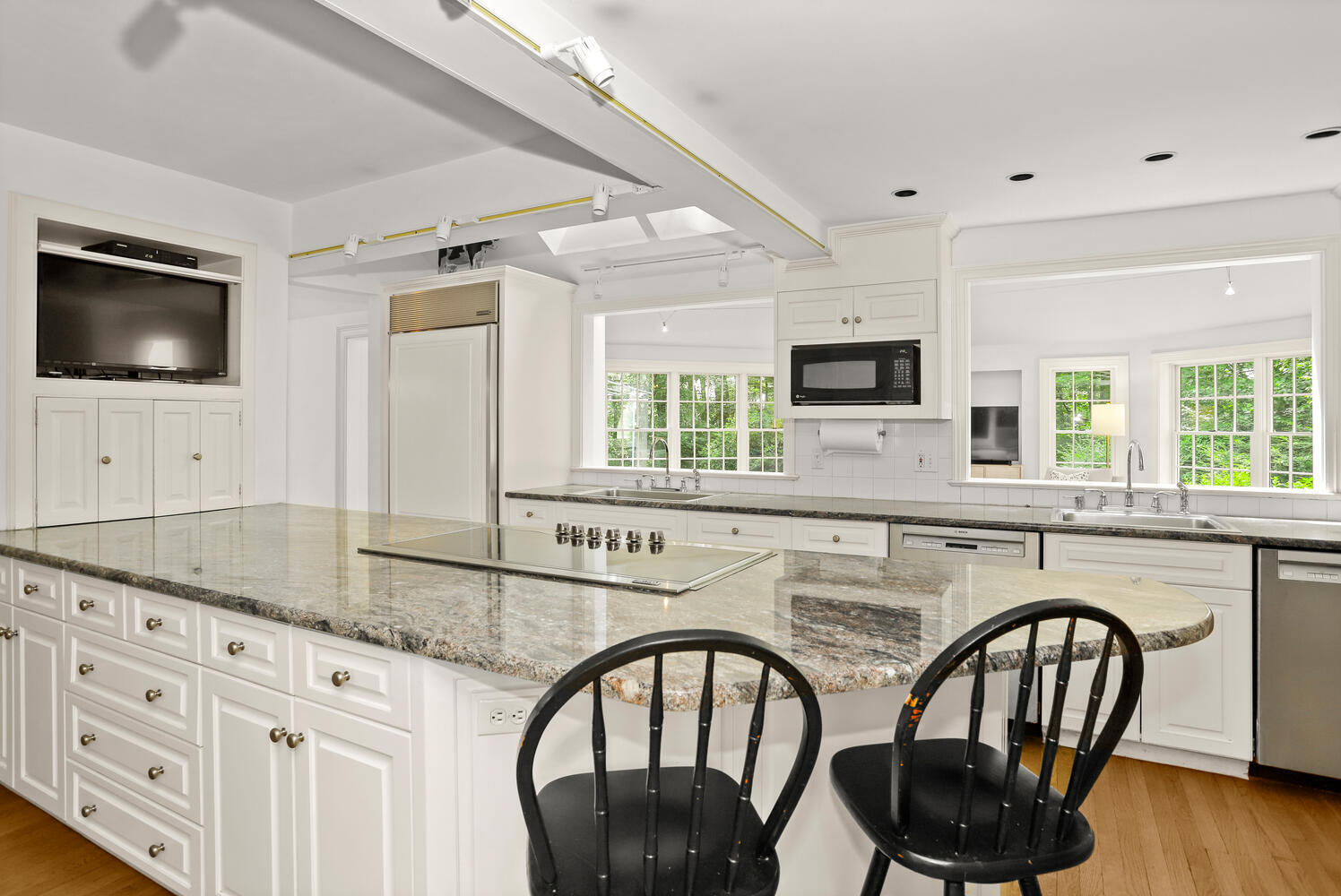 216 Turtle Back Road New Canaan, CT 06840 - Photo 12 of 38 a kitchen with stainless steel appliances granite countertop a dining table and chairs