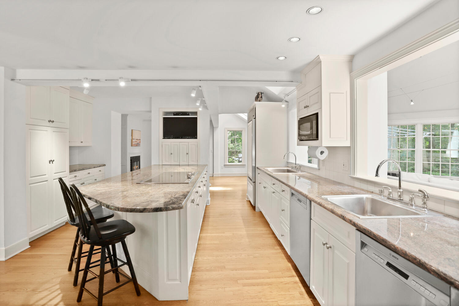 216 Turtle Back Road New Canaan, CT 06840 - Photo 13 of 38 a large kitchen with a table and chairs