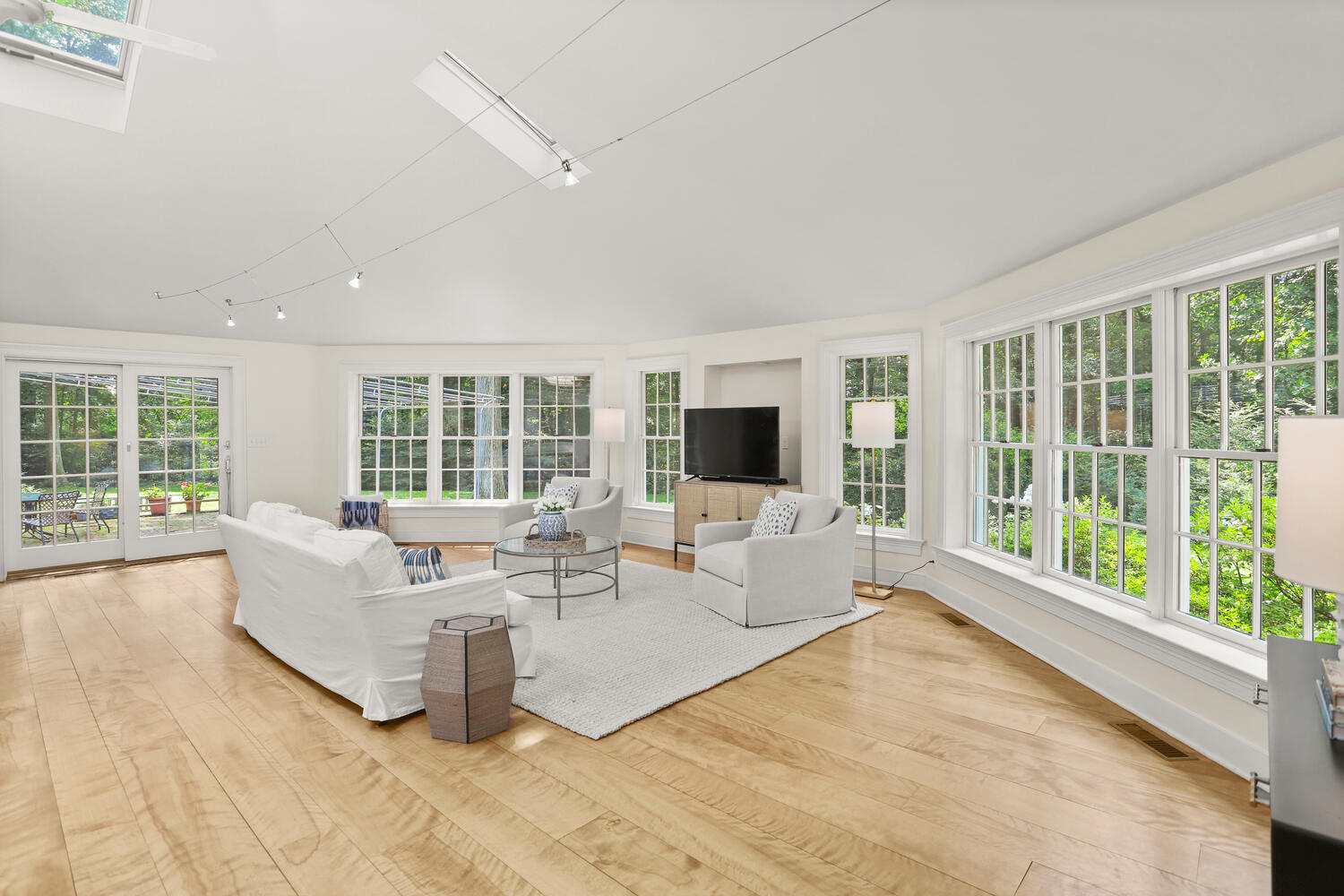 216 Turtle Back Road New Canaan, CT 06840 - Photo 14 of 38 a living room with furniture large windows and flat screen tv