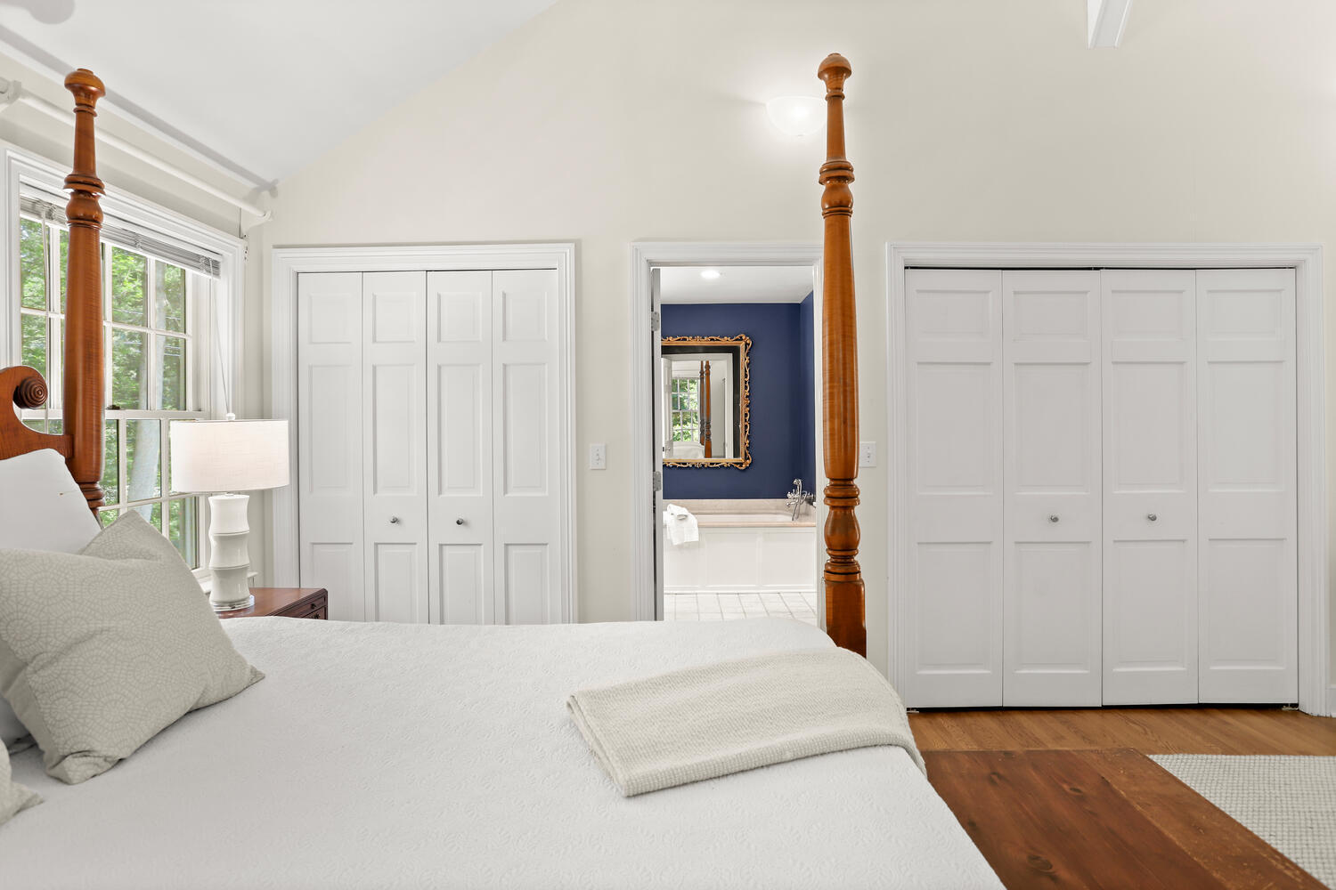 216 Turtle Back Road New Canaan, CT 06840 - Photo 19 of 38 a spacious bedroom with a large bed and a closet