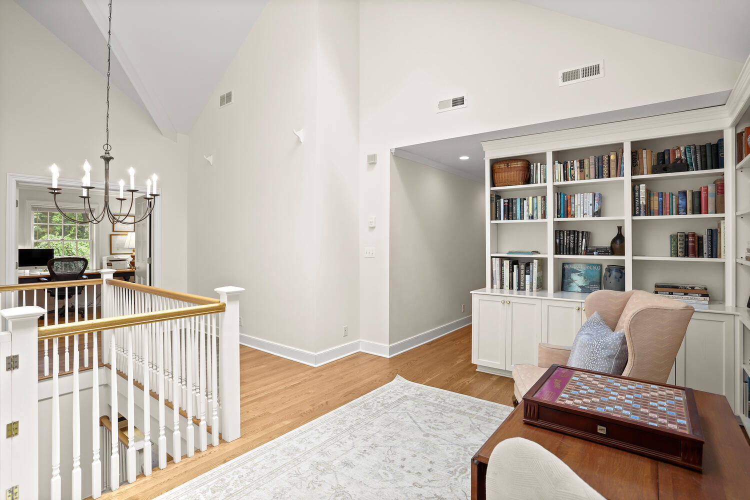 216 Turtle Back Road New Canaan, CT 06840 - Photo 26 of 38 a living room with furniture and a book shelf