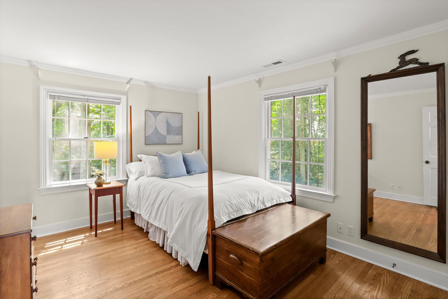 216 Turtle Back Road New Canaan, CT 06840 - Photo 27 of 38 a spacious bedroom with a bed and wooden floor