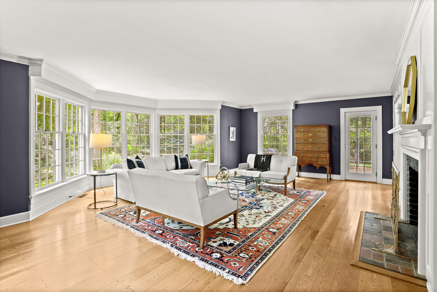 216 Turtle Back Road New Canaan, CT 06840 - Photo 7 of 38 a living room with furniture floor to ceiling window and a table