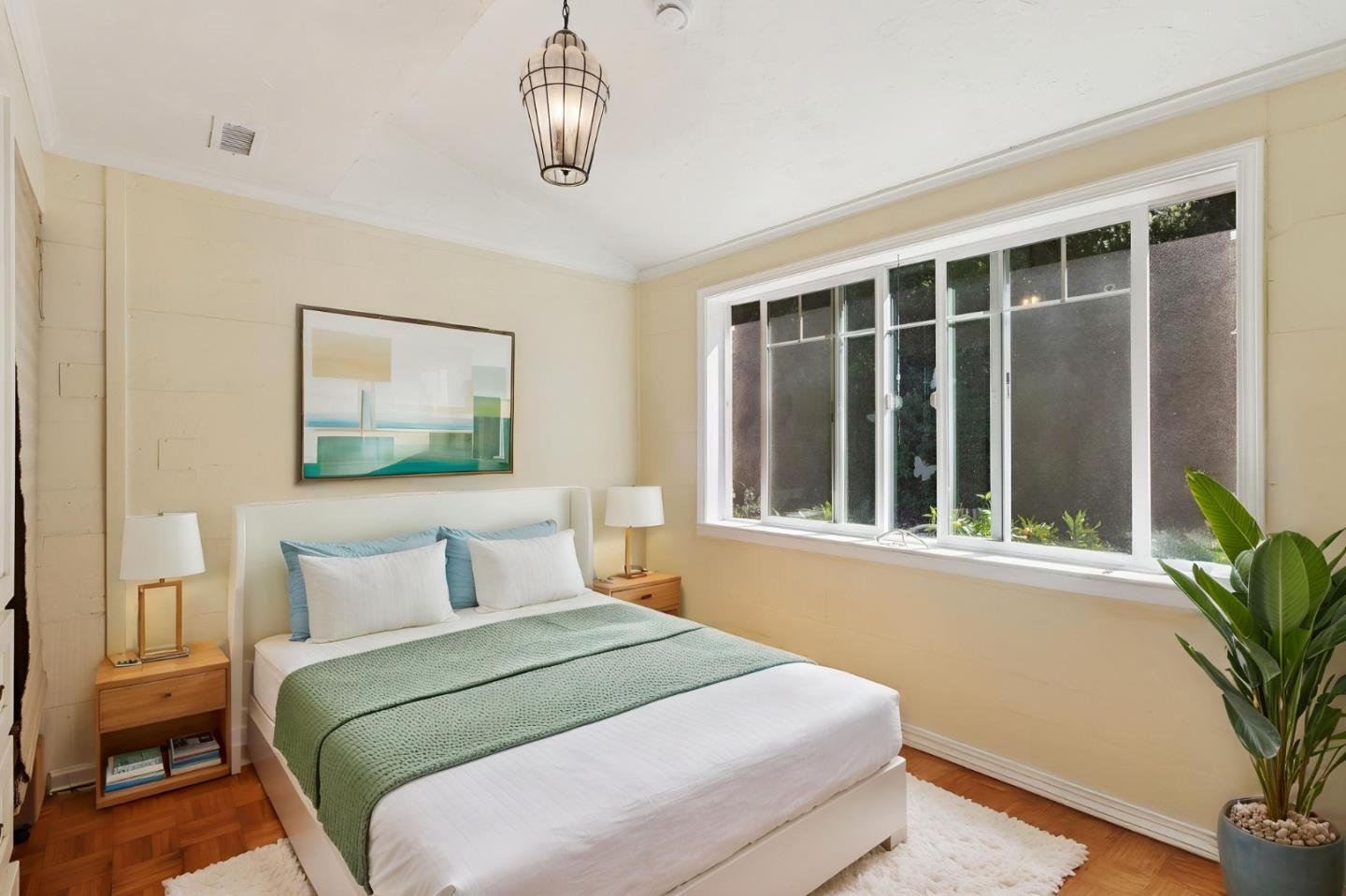 122 Strawberry Road Watsonville, CA 95076 - Photo 20 of 57 a bedroom with a large bed and a window