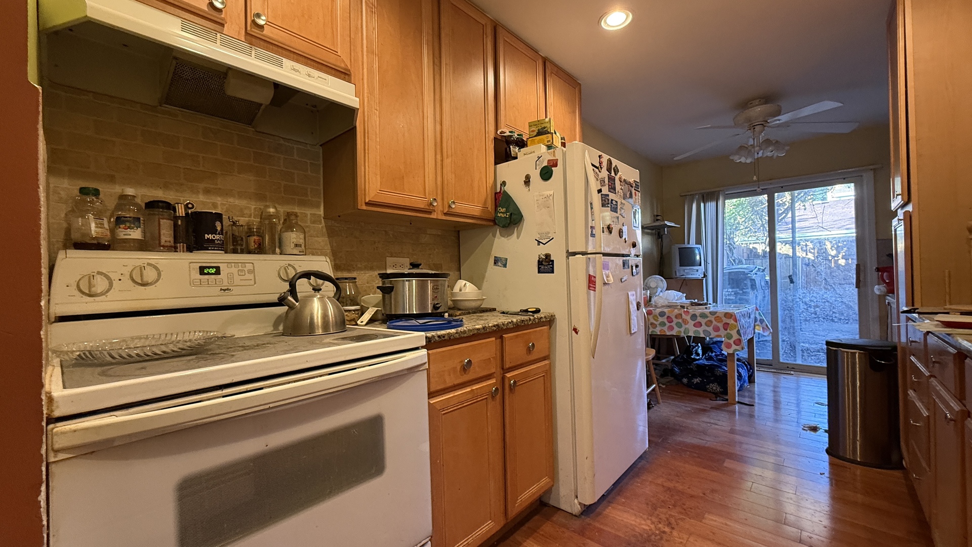 9457 Sumac Road, Unit E Des Plaines, IL 60016 - Photo 8 of 17 a kitchen with stainless steel appliances granite countertop a stove and a refrigerator