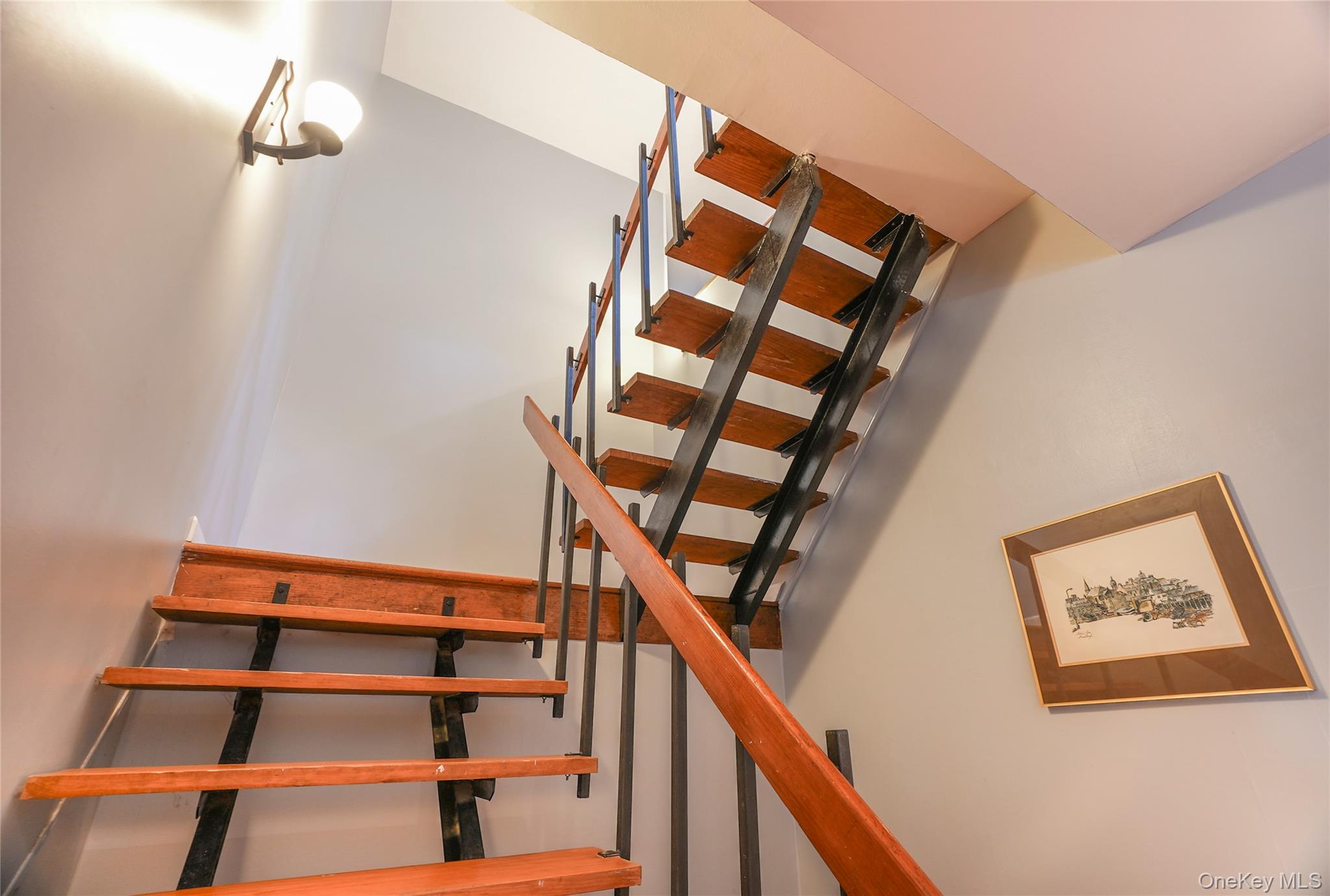 22 Peters Lane Pound Ridge, NY 10576 - Photo 25 of 43 Open tread staircase featuring wood steps and a dark metal railing system