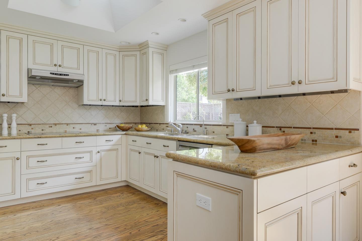 190 Pine Lane Los Altos, CA 94022 - Photo 13 of 30 a kitchen with granite countertop white cabinets sink and dishwasher