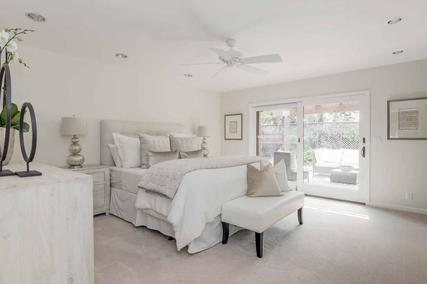 190 Pine Lane Los Altos, CA 94022 - Photo 16 of 30 a spacious bedroom with a bed lamp and a large window