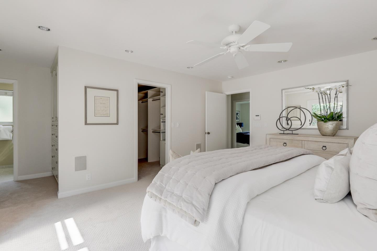 190 Pine Lane Los Altos, CA 94022 - Photo 17 of 30 a bedroom with a bed and a chandelier