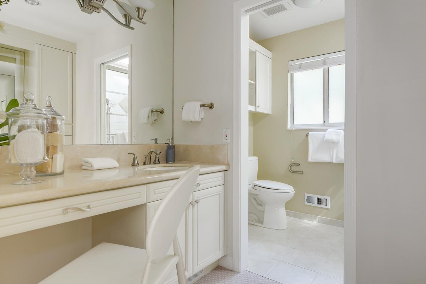 190 Pine Lane Los Altos, CA 94022 - Photo 19 of 30 a bathroom with a granite countertop sink mirror vanity and a toilet
