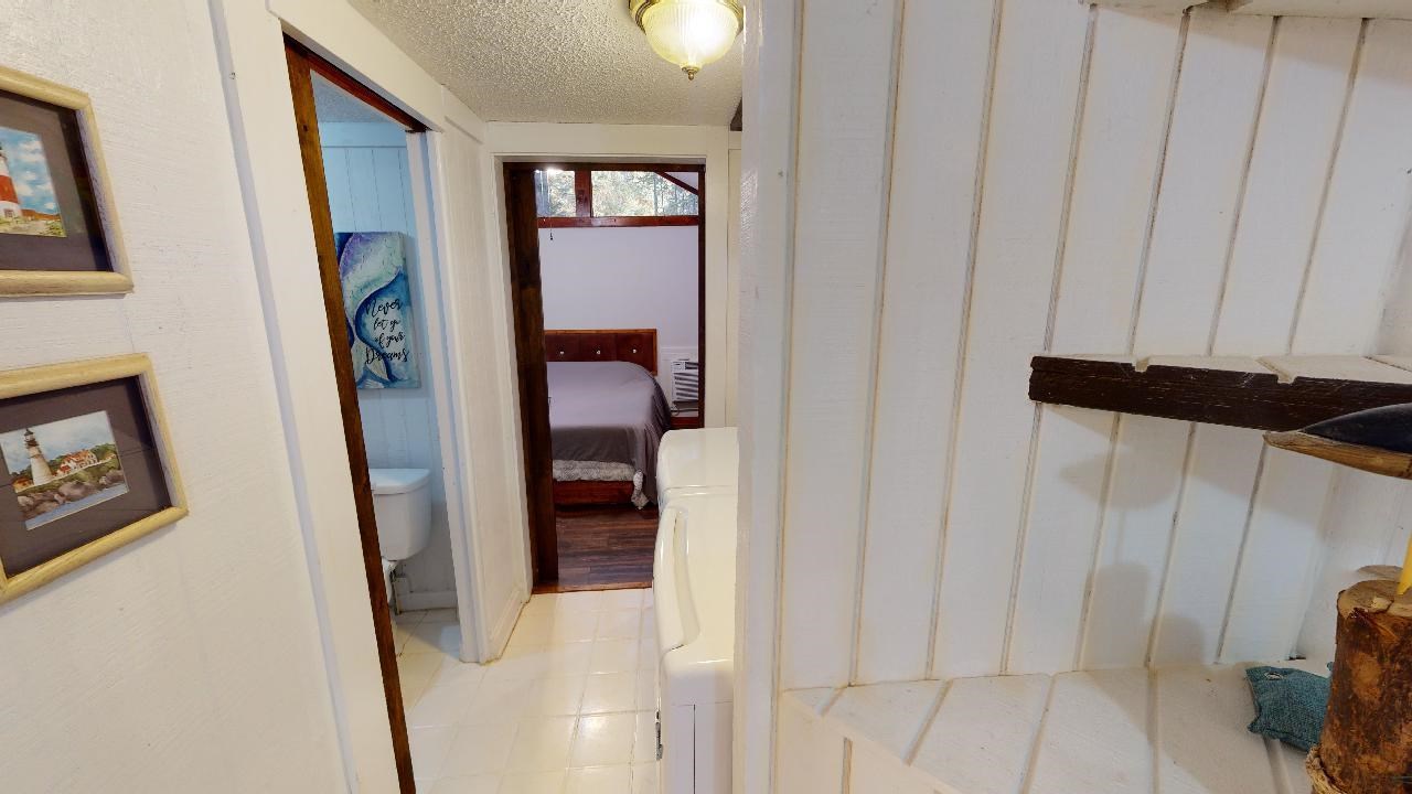 190 Micro Lane Counce, TN 38326 - Photo 17 of 25 a view of a hallway with paintings on the wall