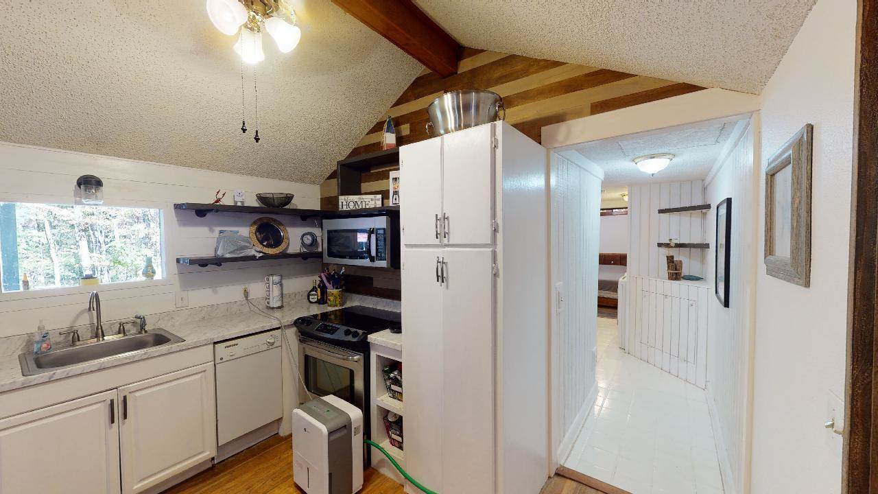 190 Micro Lane Counce, TN 38326 - Photo 8 of 25 a kitchen with stainless steel appliances a refrigerator and a sink