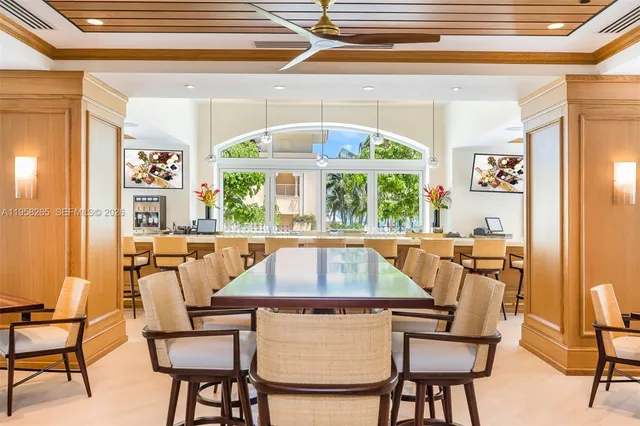 a very nice looking room with large windows and furniture