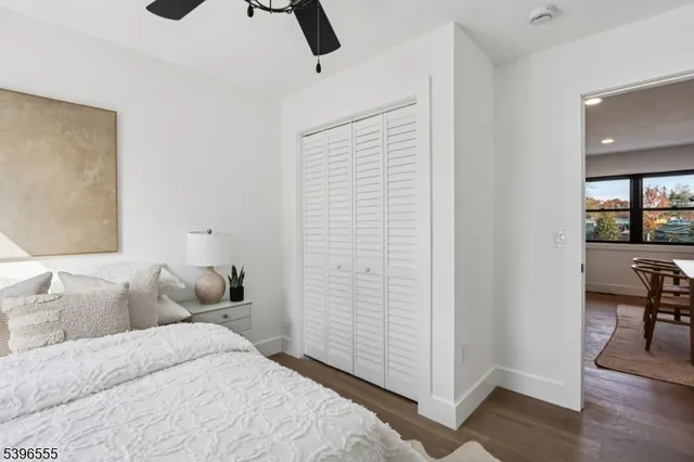 a bedroom with a bed and a table in it