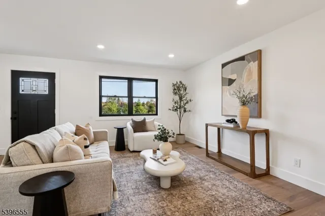 a living room with furniture and window