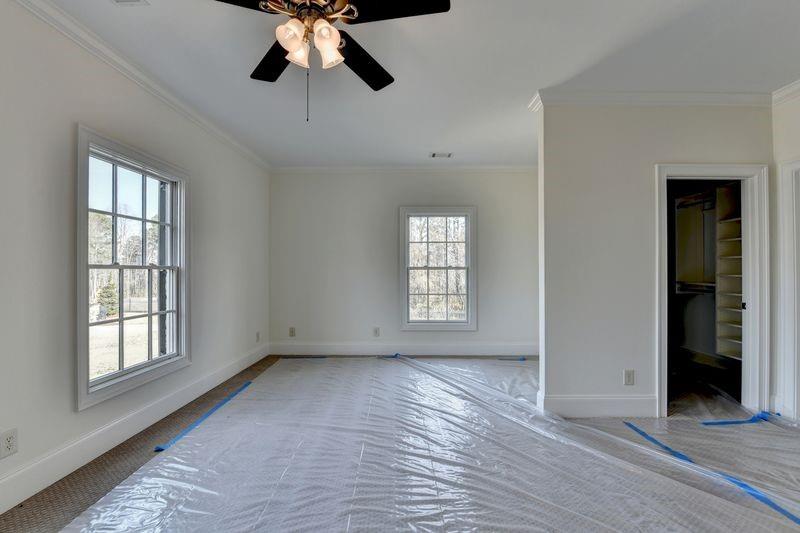 4045 Ridge Road Buford, GA 30519 - Photo 64 of 97 a view of empty room with wooden floor and fan