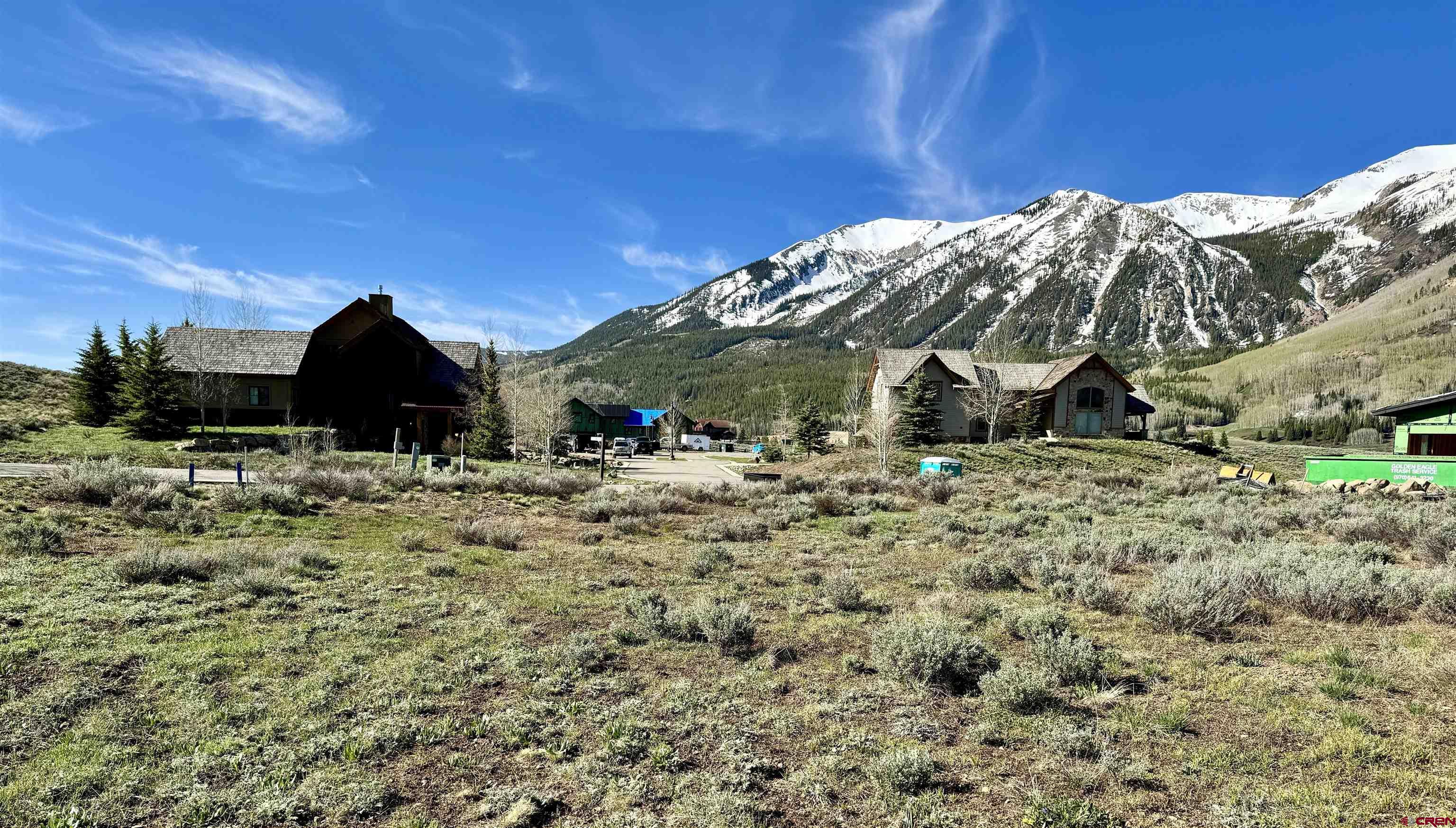 91 Larkspur Loop Crested Butte, CO 81224 - Photo 7 of 10 a view of a wooden house with a yard